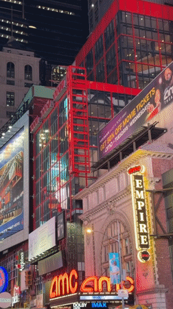 Times Square blazes with neon signs and billboard ads at night