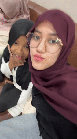 Woman documents dental clinic visit with family in Indonesia