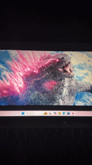 Residents watch Godzilla movie on laptop in Kirana