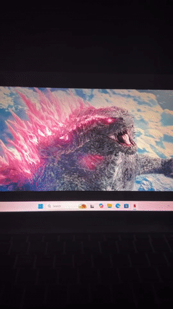 Residents watch Godzilla movie on laptop in Kirana
