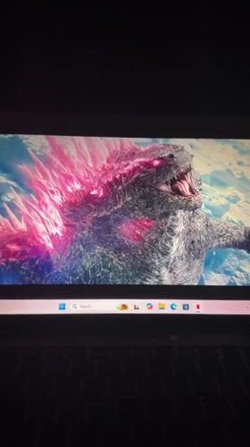 Residents watch Godzilla movie on laptop in Kirana