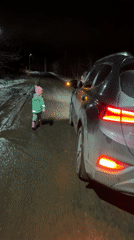 Two people photographed in low-light conditions in Gorny, Russia