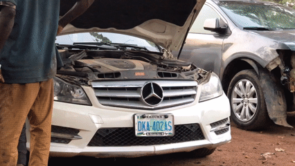 Car repair activity documented at Galadimawa Village workshop