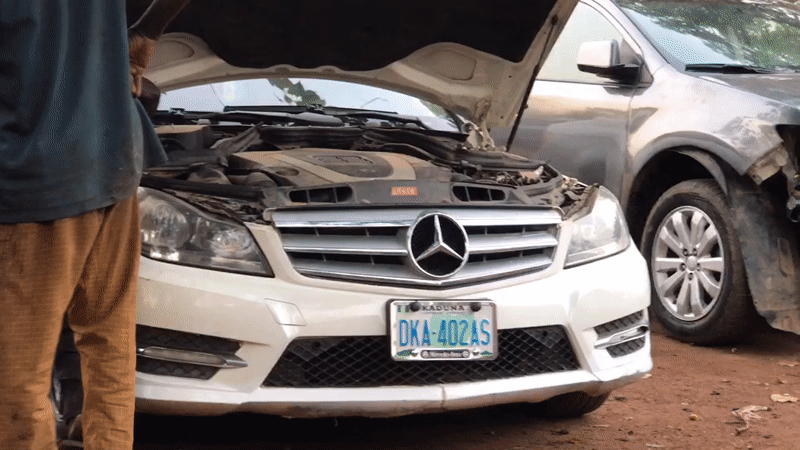 Car repair activity documented at Galadimawa Village workshop
