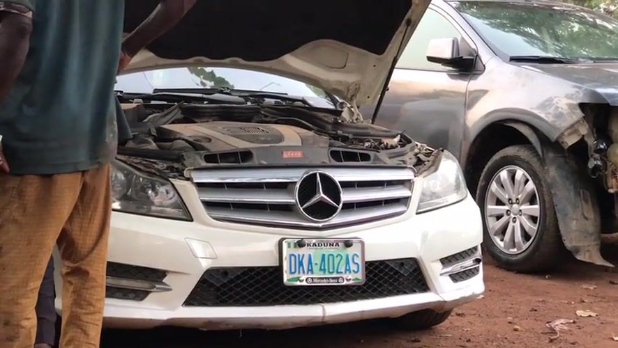Car repair activity documented at Galadimawa Village workshop