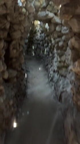 Stone tunnels and a dragon sculpture at a Cam Ranh night site
