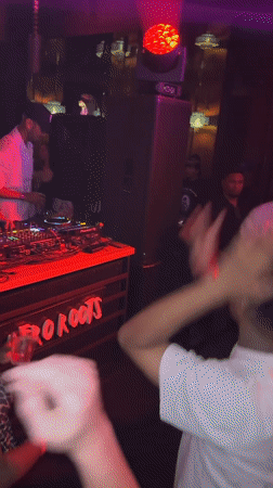 Night out at a North Kuta club, red lights and dancing