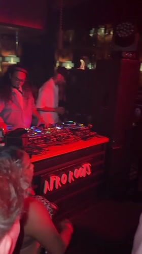 Night out at a North Kuta club, red lights and dancing