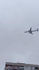 Commercial aircraft approaches Sofia airport over residential buildings