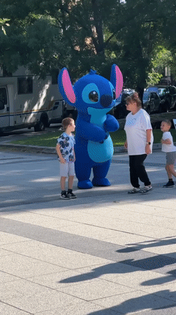 Community festival features Stitch mascot, bouncy castles, exotic birds