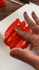Artist creates red paint artwork in Bílina, Czech Republic