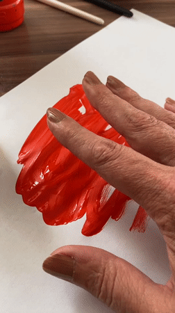 Artist creates red paint artwork in Bílina, Czech Republic