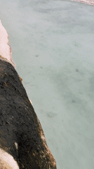 Visitors explore Pamukkale's iconic white terraces and thermal pools
