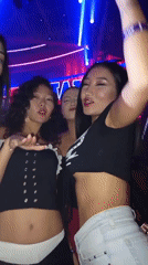 Nightclub scene with DJ performance and dancing crowds