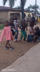 Children play and family poses in Akwanga village scenes