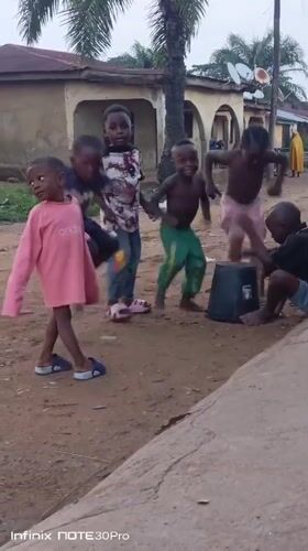 Children play and family poses in Akwanga village scenes