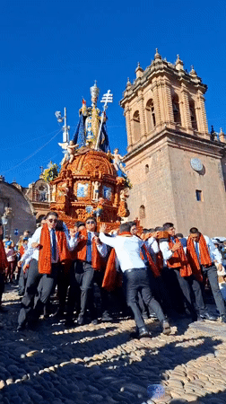 Religious procession with ornate bishop float observed in Cuzco