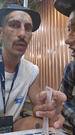 Two men document evening social gathering in Nha Trang