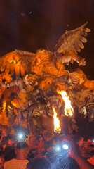Night festival features illuminated mythical floats, dancing crowds