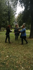 Historical reenactment with costumes, sword fights, and period tea setting in Slonim