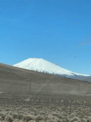 Work crew gathers on mountain road in Putre, Chile