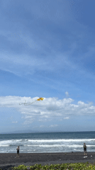 Kite flying on black sand beach in Blahbatuh, Indonesia