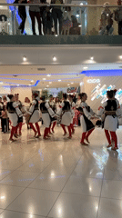 Folk dancers perform traditional circle dance in Budva shopping mall