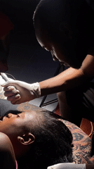 Cosmetic eyebrow tattooing session in Bar Jirgi Summa, Nigeria