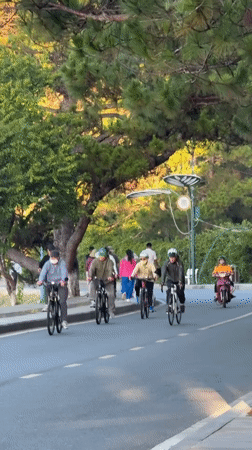 Evening lakefront activity documented in Da Lat with lotus installations