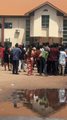 Crowd gathers outside institutional building in Ihiagwa, Nigeria