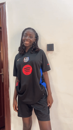 Casual moments documented in Abuja featuring Barcelona jersey selfies