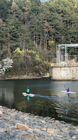 Two paddlers enjoy afternoon water sports near Pancharevo dam