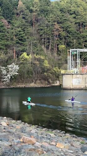 Two paddlers enjoy afternoon water sports near Pancharevo dam