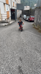 Kids play and ride bikes at a casual Saint-Claude outdoor gathering