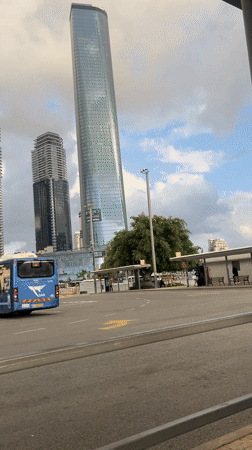 Tel Aviv city buses navigate urban streets