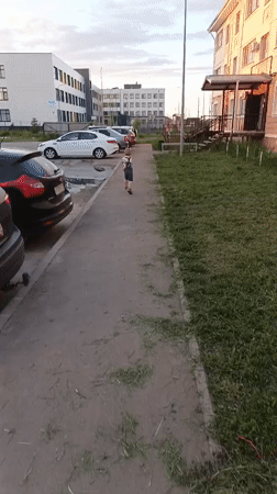 Young boy plays outdoors and indoors in Kuyuki, Russia