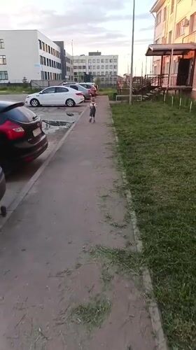 Young boy plays outdoors and indoors in Kuyuki, Russia
