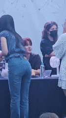 Fan meet event in Barcelona, tables, banners, and crowd interactions