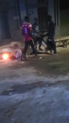 Evening scenes captured in Jogana: fires, gatherings, utility work