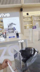 Customers unbox new phones at Cellular World store
