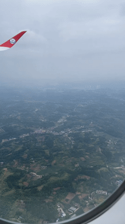 Passenger captures aerial views during flight over Jianyang City