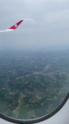 Passenger captures aerial views during flight over Jianyang City