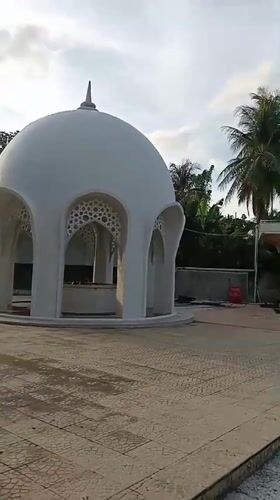 White domed structure with spire documented in Indonesia