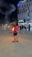 Fire performance and street gathering at night in Phú Quốc