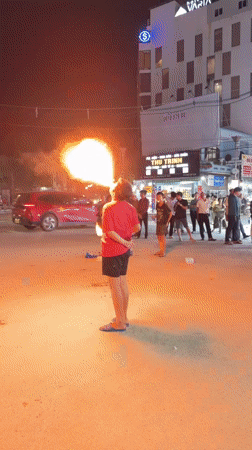 Fire performance and street gathering at night in Phú Quốc