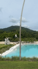 Turquoise pool resort meets giant insect exhibit in Koh Samui