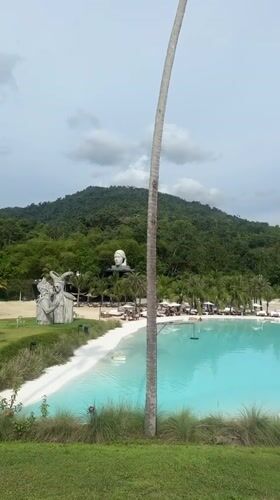 Turquoise pool resort meets giant insect exhibit in Koh Samui