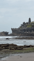 Coastal temple complex filmed under grey skies in Indonesia