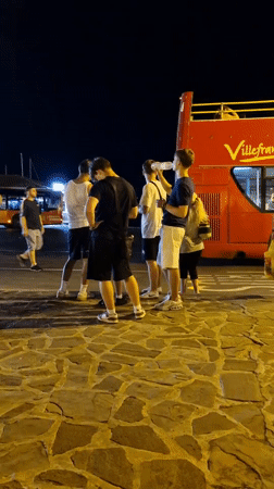 Busy summer evening on Nesebar's old town waterfront promenade