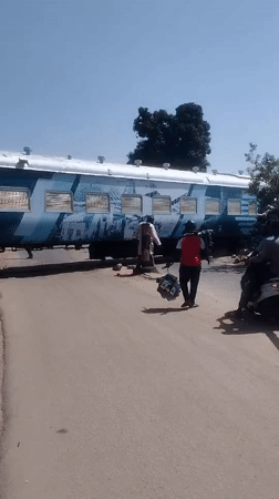 Street scenes around a Jos level crossing and Welfare Board building